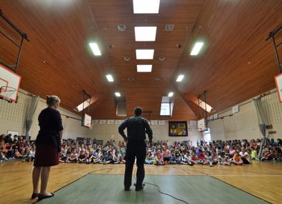 Conor talking at a school assembly at the Lincoln School